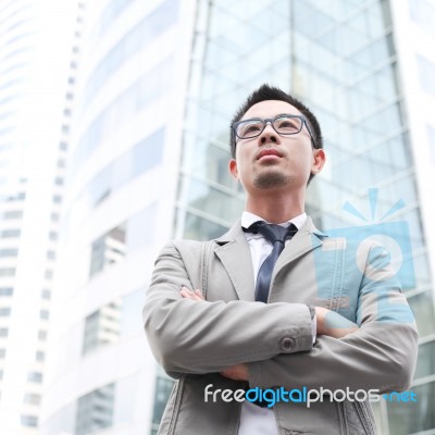 Asia Business Man Using A Mobile Phone Stock Photo