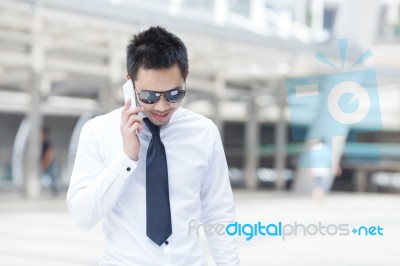 Asia Business Man Using A Mobile Phone Stock Photo