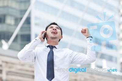 Asia Business Man Using A Mobile Phone Stock Photo