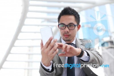 Asia Business Man Using A Mobile Phone Stock Photo