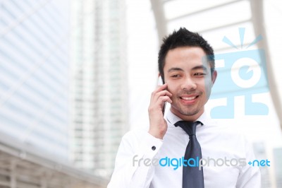 Asia Business Man Using A Mobile Phone With Copyspace Stock Photo