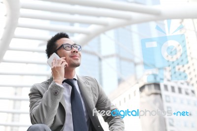 Asia Businessman Using A Mobile Phone Stock Photo