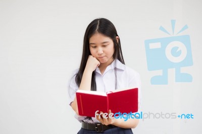 Asia Thai High School Student Uniform Beautiful Girl Read A Book… Stock Photo