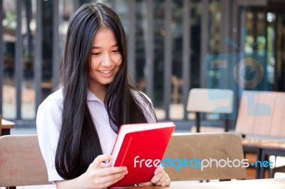 Asia Thai High School Student Uniform Beautiful Girl Read A Book… Stock Photo