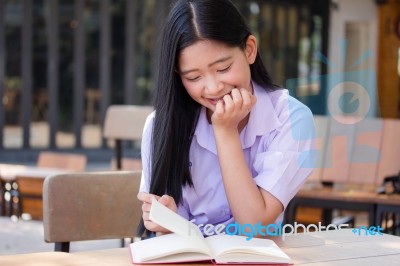 Asia Thai High School Student Uniform Beautiful Girl Read A Book… Stock Photo