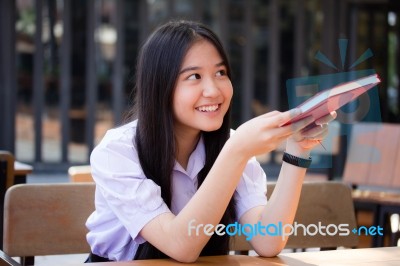 Asia Thai High School Student Uniform Beautiful Girl Read A Book… Stock Photo