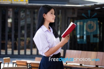 Asia Thai High School Student Uniform Beautiful Girl Read A Book… Stock Photo