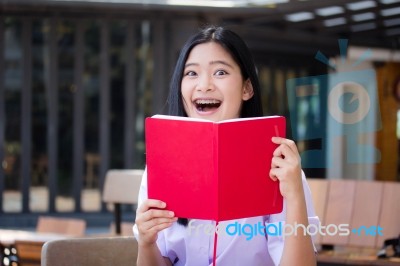 Asia Thai High School Student Uniform Beautiful Girl Read A Book… Stock Photo