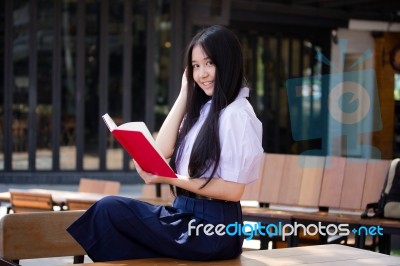 Asia Thai High School Student Uniform Beautiful Girl Read A Book… Stock Photo