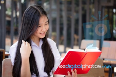 Asia Thai High School Student Uniform Beautiful Girl Read A Book… Stock Photo