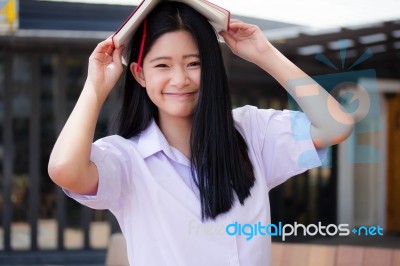 Asia Thai High School Student Uniform Beautiful Girl Read A Book… Stock Photo