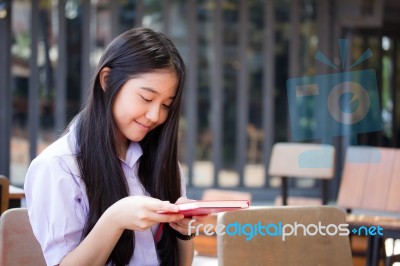 Asia Thai High School Student Uniform Beautiful Girl Read A Book… Stock Photo