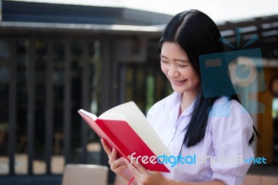 Asia Thai High School Student Uniform Beautiful Girl Read A Book… Stock Photo