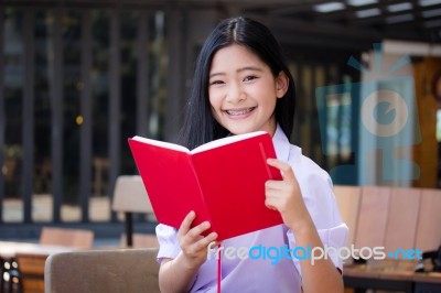 Asia Thai High School Student Uniform Beautiful Girl Read A Book… Stock Photo