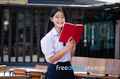 Asia Thai High School Student Uniform Beautiful Girl Read A Book… Stock Photo