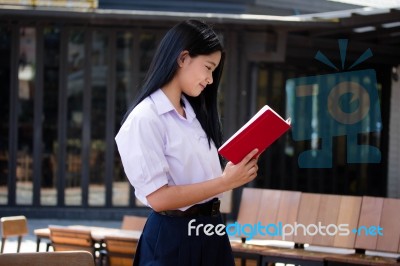 Asia Thai High School Student Uniform Beautiful Girl Read A Book… Stock Photo