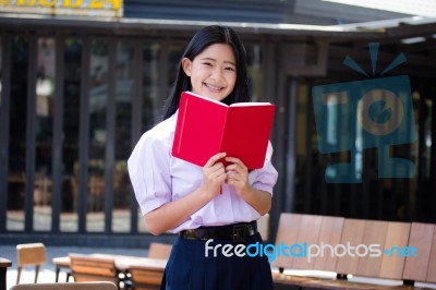 Asia Thai High School Student Uniform Beautiful Girl Read A Book… Stock Photo