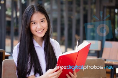 Asia Thai High School Student Uniform Beautiful Girl Read A Book… Stock Photo