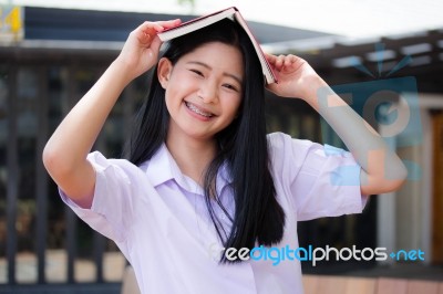 Asia Thai High School Student Uniform Beautiful Girl Read A Book… Stock Photo