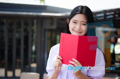 Asia Thai High School Student Uniform Beautiful Girl Read A Book… Stock Photo