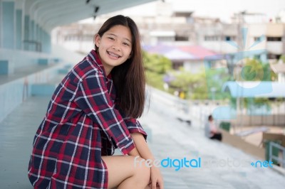 Asia Thai Teenager Women Scotch T-shirt Relax And Smile Stock Photo