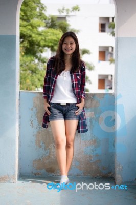 Asia Thai Teenager Women Scotch T-shirt Relax And Smile Stock Photo