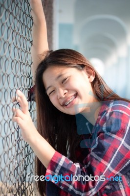 Asia Thai Teenager Women Scotch T-shirt Relax And Smile Stock Photo