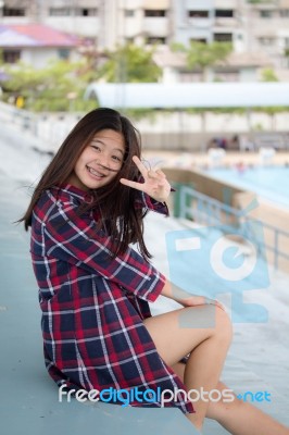 Asia Thai Teenager Women Scotch T-shirt Relax And Smile Stock Photo