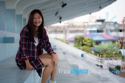 Asia Thai Teenager Women Scotch T-shirt Relax And Smile Stock Photo