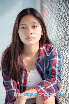 Asia Thai Teenager Women Scotch T-shirt Relax And Smile Stock Photo