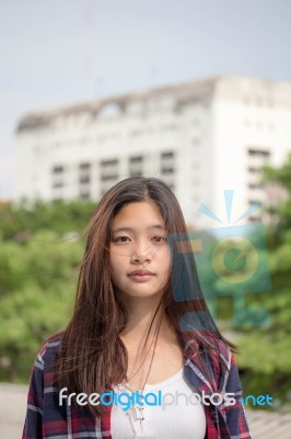 Asia Thai Teenager Women Scotch T-shirt Relax And Smile Stock Photo