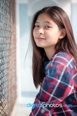 Asia Thai Teenager Women Scotch T-shirt Relax And Smile Stock Photo