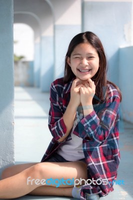 Asia Thai Teenager Women Scotch T-shirt Relax And Smile Stock Photo