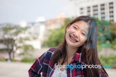 Asia Thai Teenager Women Scotch T-shirt Relax And Smile Stock Photo