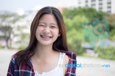 Asia Thai Teenager Women Scotch T-shirt Relax And Smile Stock Photo