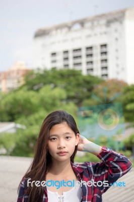 Asia Thai Teenager Women Scotch T-shirt Relax And Smile Stock Photo