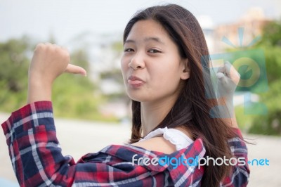 Asia Thai Teenager Women Scotch T-shirt Relax And Smile Stock Photo