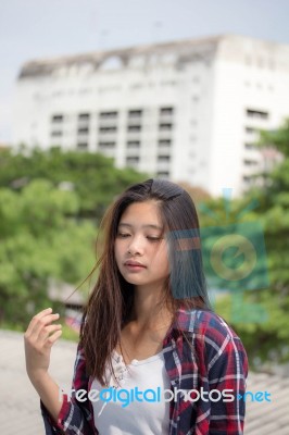 Asia Thai Teenager Women Scotch T-shirt Relax And Smile Stock Photo