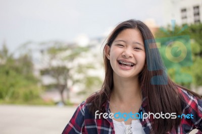 Asia Thai Teenager Women Scotch T-shirt Relax And Smile Stock Photo