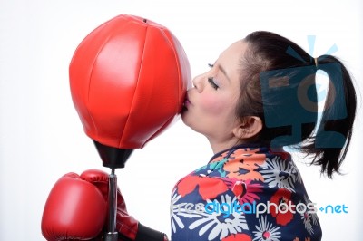 Asian Boxing Woman Kiss Punching Bag Stock Photo