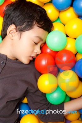 Asian Boy And Colorful Small Ball Stock Photo