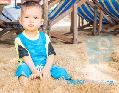 Asian Boy Playing On The Beach Stock Photo