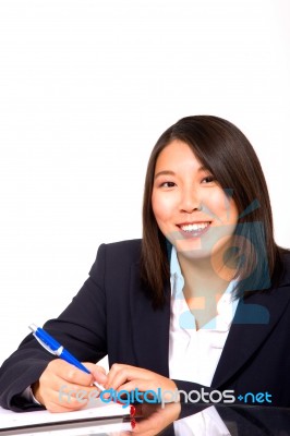 Asian Businesswoman Writing Stock Photo