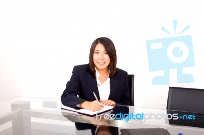 Asian Businesswoman Writing Stock Photo