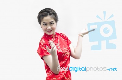 Asian Chinese Woman In Traditional Chinese Cheongsam Gesturing Stock Photo