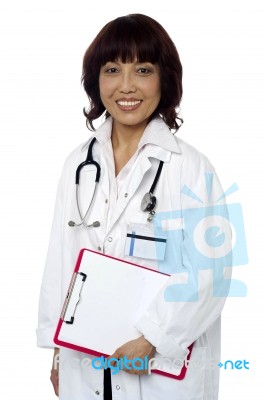 Asian Doctor Holding Clipboard Stock Photo