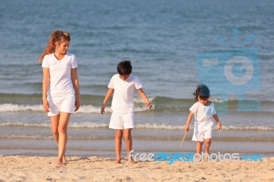 Asian Family On Beach Stock Photo