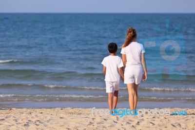 Asian Family On Beach Stock Photo