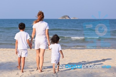 Asian Family On Beach Stock Photo