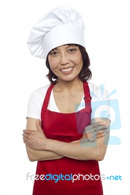 Asian Female Chef With Crossed Arms Stock Photo